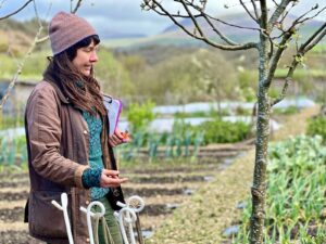 Woman standing in front of a market garden